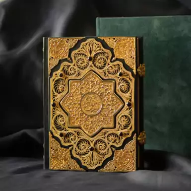 Collectible Quran with gold filigree, casting and garnets