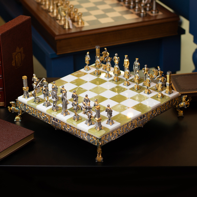 A set of chess with a board covered with precious metals from the Italian brand Italfama