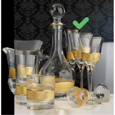 A set of gilded champagne glasses by the Italian brand Cre Art