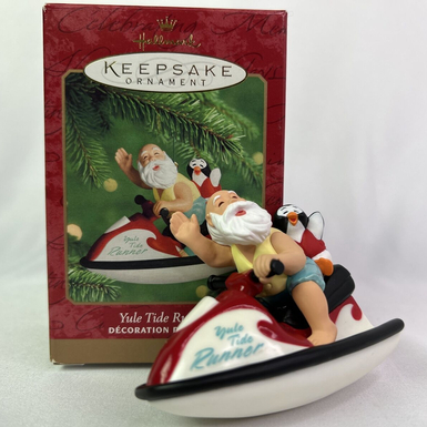 Вінтажна різдвяна прикраса в коробці (ручна робота) Санта-Клаус з пінгвіном на водному мотоциклі "Yule Tide Runner" 2000 року