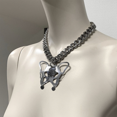 Neck decoration with "Pelvis" pendant from the "Anatomica" collection by Helena Romanova