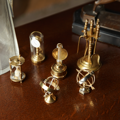 A set of "Slipsy" brass and glass miniatures