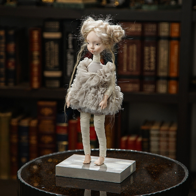 Author's small interior handmade doll in gray