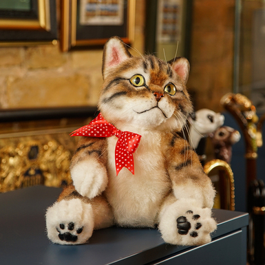 Author's artificial fur toy "Cat with a bow"