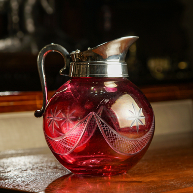 Glass drinking jug with silver plating, first half of the 20th century