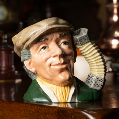 Фарфоровый кувшин "The Busker" 1988-1991 годов от Royal Doulton, Англия