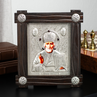 Icon "Saint Nicholas the Wonderworker" with silver plating in a wooden frame