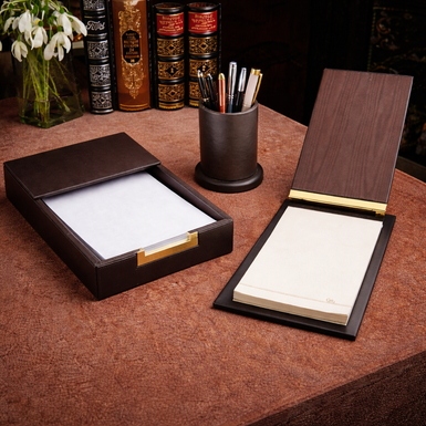 A gift set of leather pen holder, leather paper holder, and luxury desk notepad by Renzo Romagnoli
