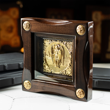 Icon of Archangel Michael with gilding in a wooden frame