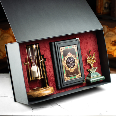 Gift set: Robert Greene's book "The 48 Laws of Power," a vintage hourglass "Royal Compass - 1953," a custom-made figurine of the Coat of Arms of Ukraine, the Trident, and a gift box.