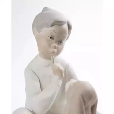 figurine of a boy with a dog