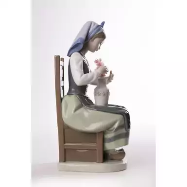 exquisite figurine of a girl with flowers