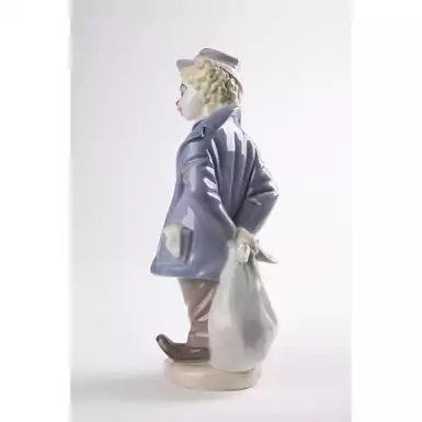 exclusive figurine of a boy with a bag