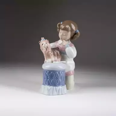 original figurine of a girl with a dog
