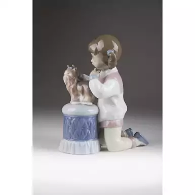 porcelain figurine of a girl with a puppy as a gift