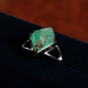 a ring with an emerald