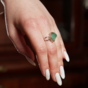 a ring with an emerald buy