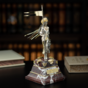 statuette made of silver and gold photo