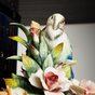 Composition of a parrot and flowers photo