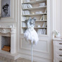 Plastic figurine "White Swan" on a stand in the room