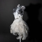 Plastic figurine "White Swan" on a black background