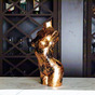 Decorative black and gold art lamp "Aphrodite" on the bar counter