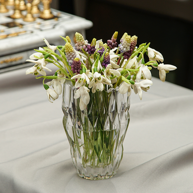 Bouquet of cold porcelain primroses in a Bohemian glass vase, author Marina Malinovskaya