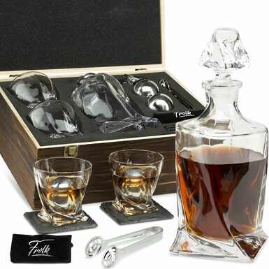 glasses and a decanter for whiskey in a photo case