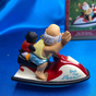 Санта-Клаус із пінгвіном на водному мотоциклі "Yule Tide Runner" 2000 року фото