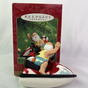 Vintage Christmas decoration in box (handmade) Santa Claus with penguin on jet ski photo