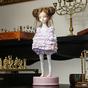 Авторська інтерʼєрна лялька ручної роботи в фіолетовому фото