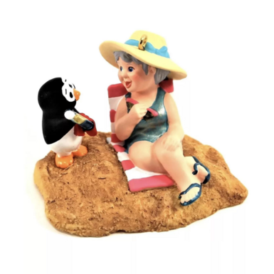 Toy woman with penguin photo