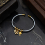 Force of Nature bracelet in Damascus steel and gold plating by Anframa photo