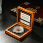 collectible coin in a wooden case