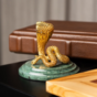 Snake statuette on a stand photo