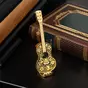 video Figurine "Guitar in miniature" made of Damascus steel and gold plated