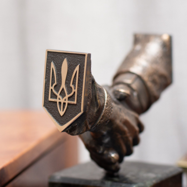 Coat of arms of Ukraine made of brass photo