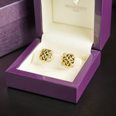 Запонки із золота з оніксом фото