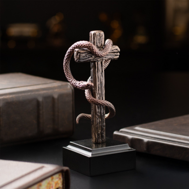 Bronze snake with cross photo