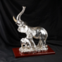 Statuette of a female elephant with a baby elephant photo