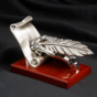 Statuette hand with feather photo