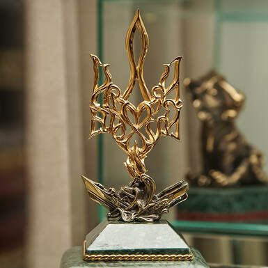 Позолочена статуетка фото