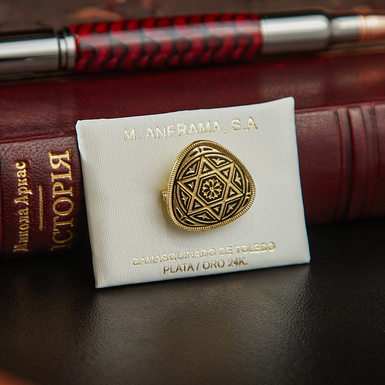 Brooch made of damask steel photo