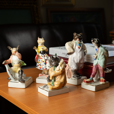 Porcelain figurines on stands photo