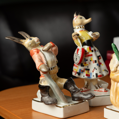 Porcelain figurines on stands photo