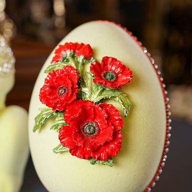 Red flowers on easter egg photo