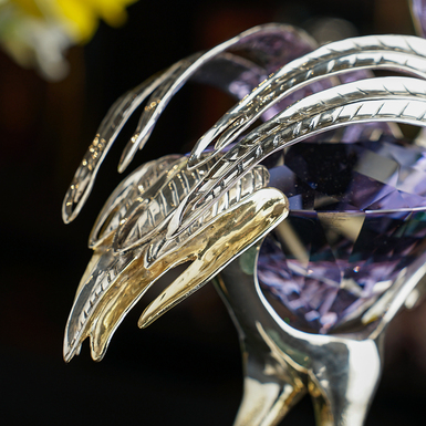 Silver bird sculpture photo