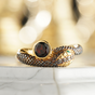 Silver ring "Snake" with emerald and ruby ​​inserts photo