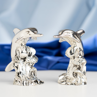 Buy a silver-plated figurine of a pair of dolphins