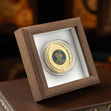 серебряная монета в рамке фото 1